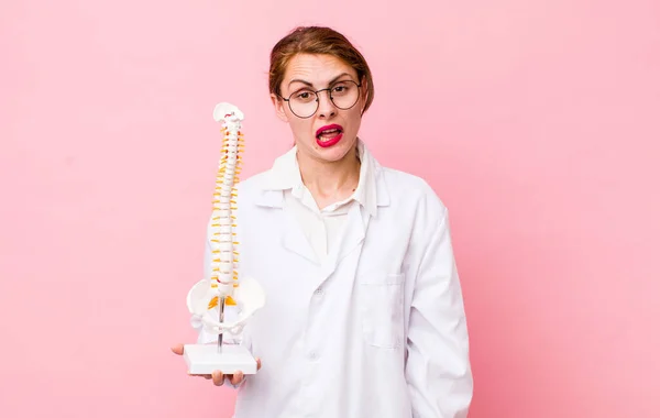 Young Pretty Woman Looking Puzzled Confused Spine Specialist Concept — Stock Fotó