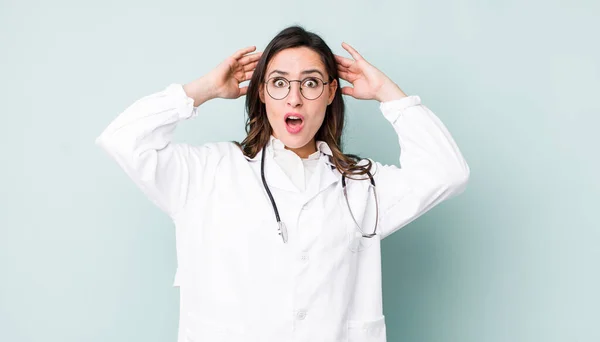 Young Pretty Woman Feeling Stressed Anxious Scared Hands Head Physician — Stockfoto