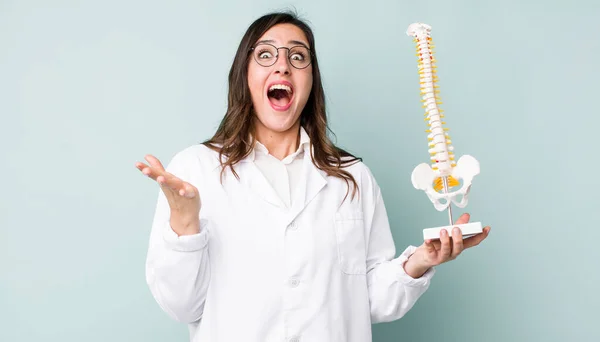 Young Pretty Woman Feeling Extremely Shocked Surprised Spine Specialist Concept — Stock Fotó