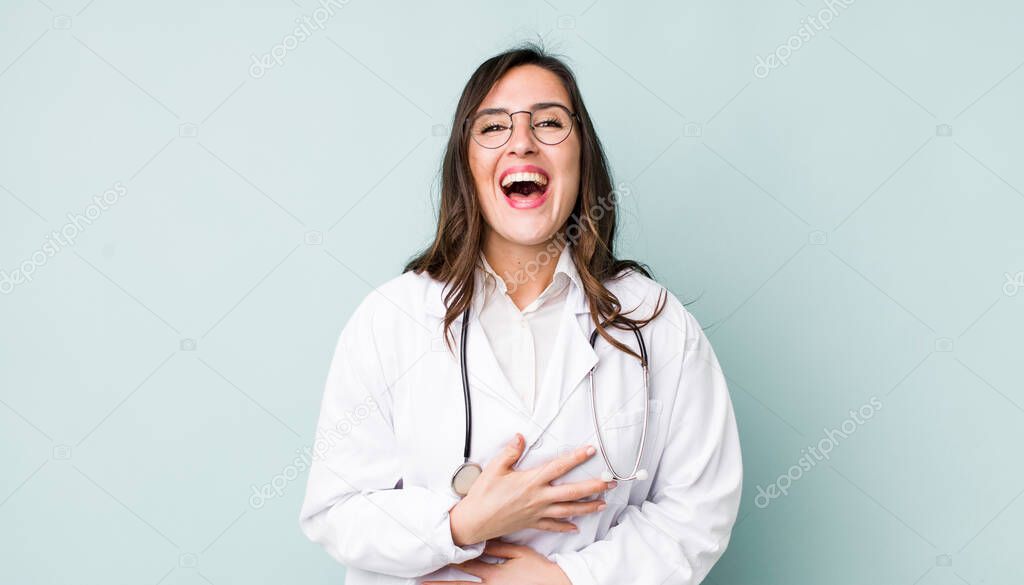 young pretty woman  laughing out loud at some hilarious joke. physician concept
