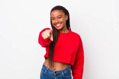 afro pretty woman pointing at camera with a satisfied, confident, friendly smile, choosing you