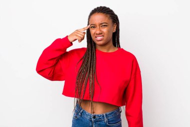 afro pretty woman feeling confused and puzzled, showing you are insane, crazy or out of your mind