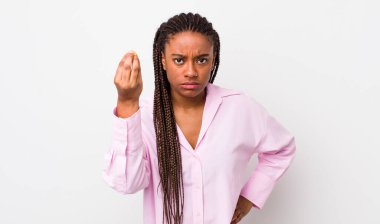 afro pretty woman making capice or money gesture, telling you to pay your debts!