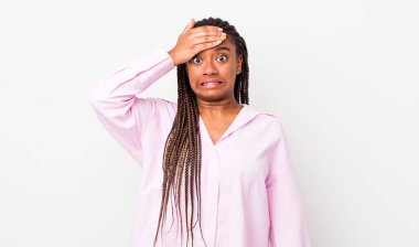 afro pretty woman panicking over a forgotten deadline, feeling stressed, having to cover up a mess or mistake