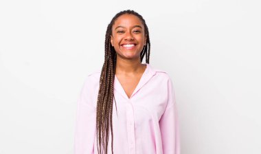 afro pretty woman looking happy and goofy with a broad, fun, loony smile and eyes wide open