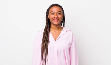 afro pretty woman smiling positively and confidently, looking satisfied, friendly and happy