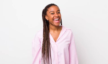 afro pretty woman with a big, friendly, carefree smile, looking positive, relaxed and happy, chilling