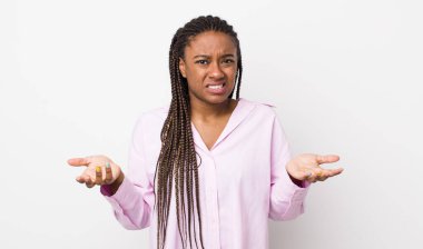 afro pretty woman feeling clueless and confused, not sure which choice or option to pick, wondering