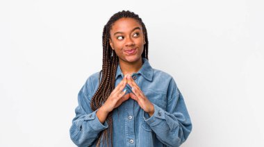 afro pretty woman scheming and conspiring, thinking devious tricks and cheats, cunning and betraying