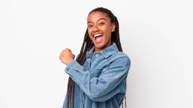 afro pretty woman feeling happy, positive and successful, motivated when facing a challenge or celebrating good results