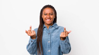 afro pretty woman feeling provocative, aggressive and obscene, flipping the middle finger, with a rebellious attitude