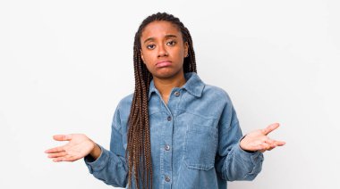 afro pretty woman feeling puzzled and confused, unsure about the correct answer or decision, trying to make a choice