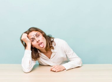 young pretty businesswoman sitting with a table