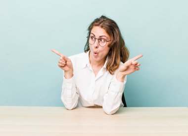 young pretty businesswoman sitting with a table