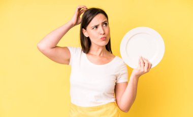 young adult pretty woman home chef with empty plate