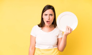 young adult pretty woman home chef with empty plate