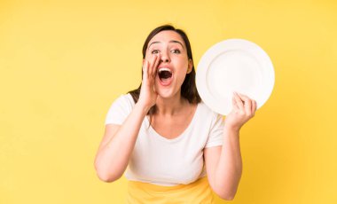 young adult pretty woman home chef with empty plate