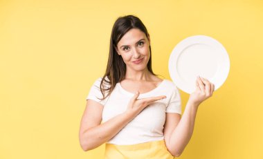 young adult pretty woman home chef with empty plate