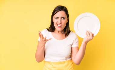 young adult pretty woman home chef with empty plate