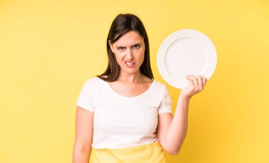 young adult pretty woman home chef with empty plate