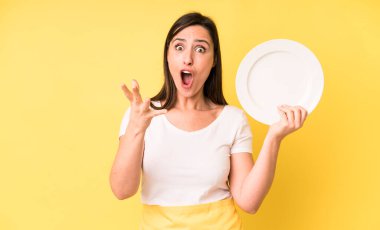 young adult pretty woman home chef with empty plate