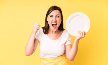 young adult pretty woman home chef with empty plate