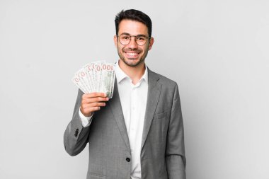 Genç, yakışıklı İspanyol adam işi ve banknotlar konsepti