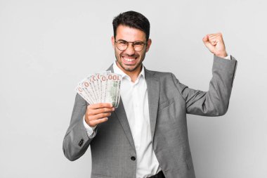 young adult handsome hispanic man business and banknotes concept