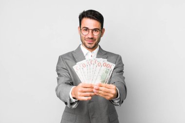 Genç, yakışıklı İspanyol adam işi ve banknotlar konsepti