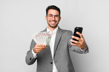 young adult handsome hispanic man business and banknotes concept