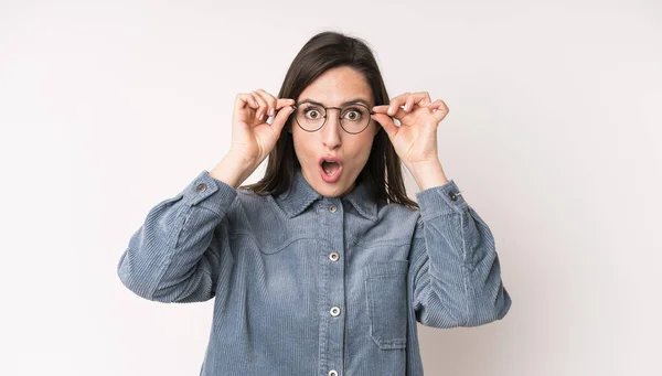Young Adult Pretty Woman Feeling Shocked Amazed Surprised Holding Glasses — Fotografia de Stock