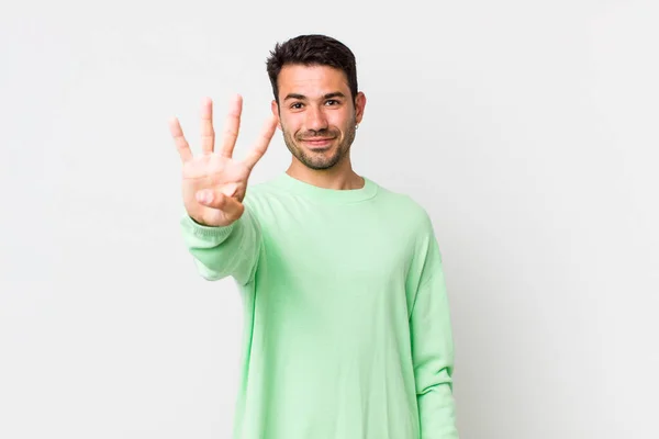 Young Handsome Hicpanic Man Smiling Looking Friendly Showing Number Four — Stock Photo, Image