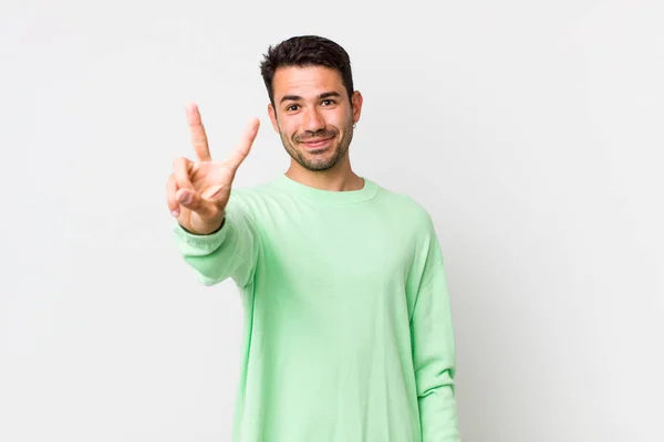 Young Handsome Hicpanic Man Smiling Looking Friendly Showing Number Two — Stock Photo, Image