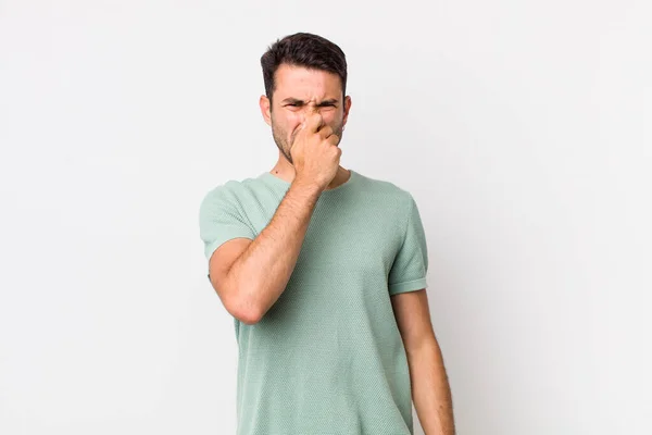 Young Handsome Hicpanic Man Feeling Disgusted Holding Nose Avoid Smelling — Stock Photo, Image