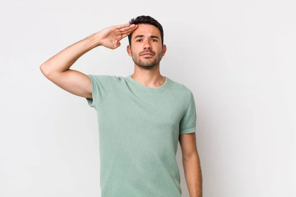 Young Handsome Hicpanic Man Greeting Camera Military Salute Act Honor — Stockfoto