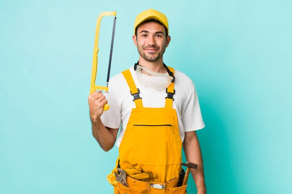 Young Adult Man Handyman Saw Concept — Stockfoto