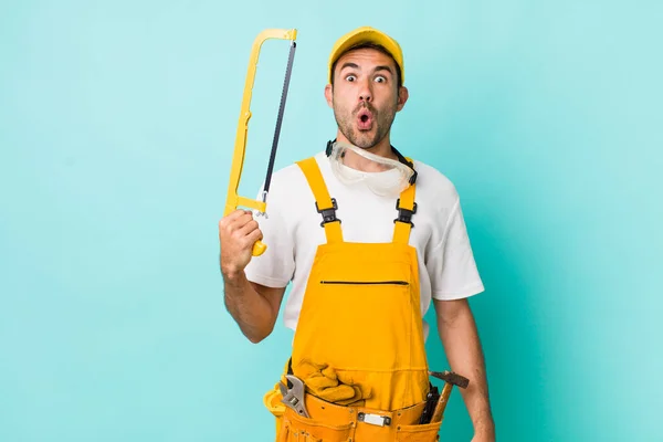 Young Adult Man Handyman Saw Concept — Stockfoto