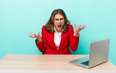 young adult pretty woman with a laptop. business concept