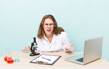 young physician woman with a microscophe. sciencist concept