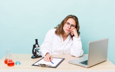 young physician woman with a microscophe. sciencist concept