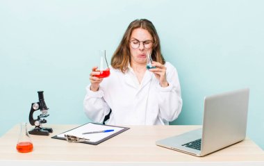 young physician woman with a microscophe. sciencist concept