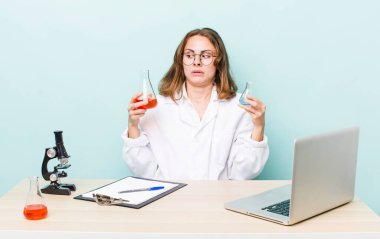 young physician woman with a microscophe. sciencist concept