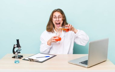 young physician woman with a microscophe. sciencist concept