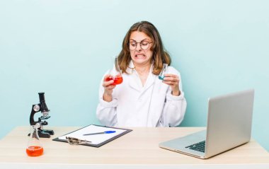 young physician woman with a microscophe. sciencist concept