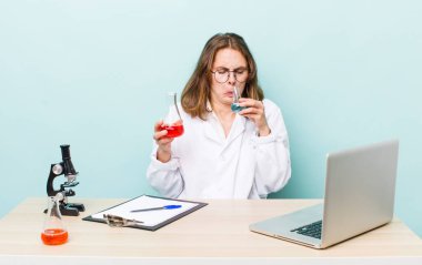 young physician woman with a microscophe. sciencist concept