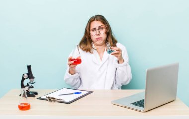 young physician woman with a microscophe. sciencist concept