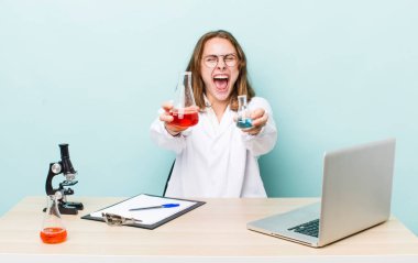 young physician woman with a microscophe. sciencist concept