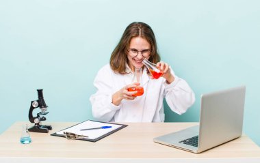 young physician woman with a microscophe. sciencist concept