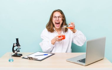 young physician woman with a microscophe. sciencist concept