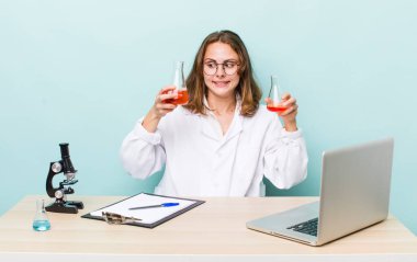 young physician woman with a microscophe. sciencist concept